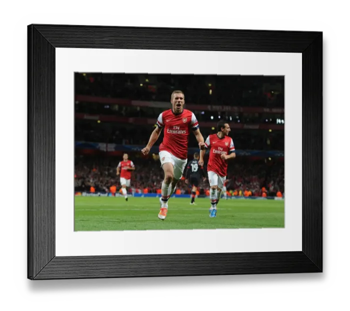 Framed Print : Lukas Podolski's Brace: Arsenal FC Triumphs Over Olympiacos FC in Champions League (2012)