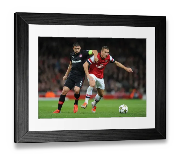 Framed Print : Arsenal Triumphs Over Olympiacos: Lukas Podolski Scores in a 3-1 UEFA Champions League Victory Framed Print : Arsenal Triumphs Over Olympiacos: Lukas Podolski Scores in a 3-1 UEFA Champions League Victory