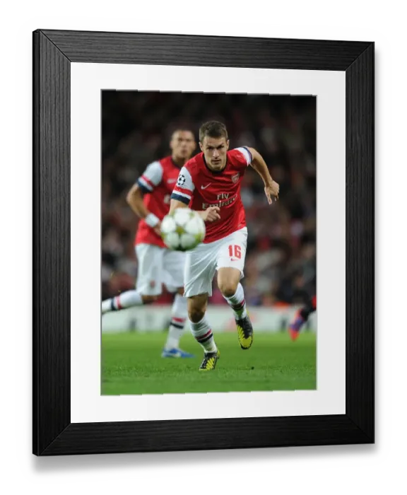 Framed Print : Aaron Ramsey in Action: Arsenal vs Olympiacos, UEFA Champions League 2012-13