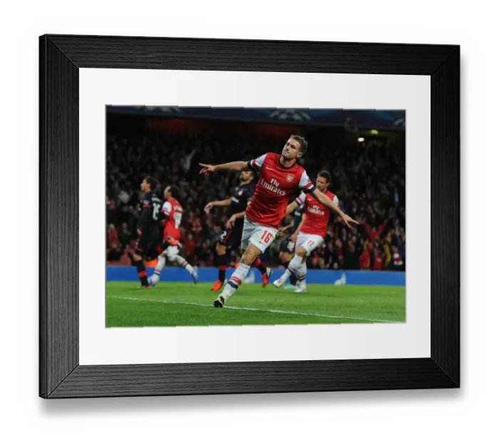 Framed Print : Aaron Ramsey's Hat-Trick: Arsenal FC Triumphs Over Olympiacos FC in the UEFA Champions League (2012)