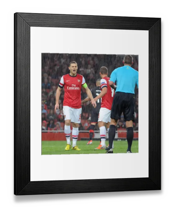 Framed Print : Thomas Vermaelen's Controversial Moment: Arsenal's 3-1 Victory over Olympiacos in the UEFA Champions League, Group B (2012) Framed Print : Thomas Vermaelen's Controversial Moment: Arsenal's 3-1 Victory over Olympiacos in the UEFA Champions League, Group B (2012)