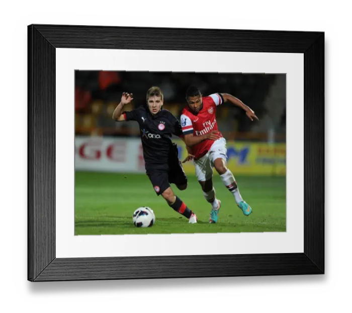 Framed Print : Serge Gnabry's Breakout Performance: Outshining Dimitrios Voutsiotis in Arsenal U19's Victory over Olympiacos, 2012