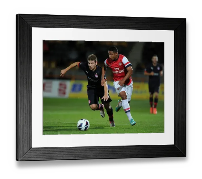Framed Print : Serge Gnabry's Agile Moves: Outshining Dimitrios Voutsiotis in Arsenal U19's NextGen Series Match against Olympiacos