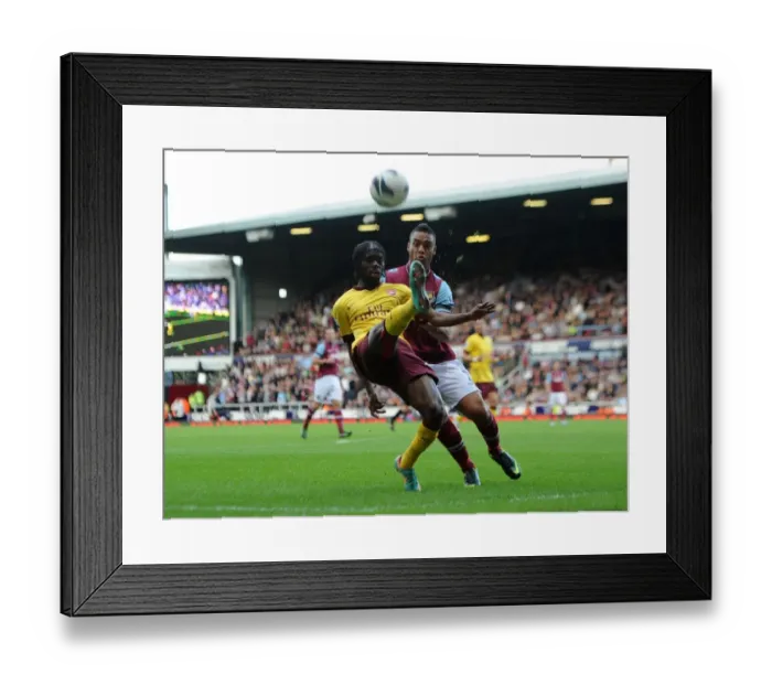 Framed Print : Gervinho vs. Winston Reid: Intense Battle at the Boleyn Ground - Arsenal vs. West Ham United, Premier League 2012-13