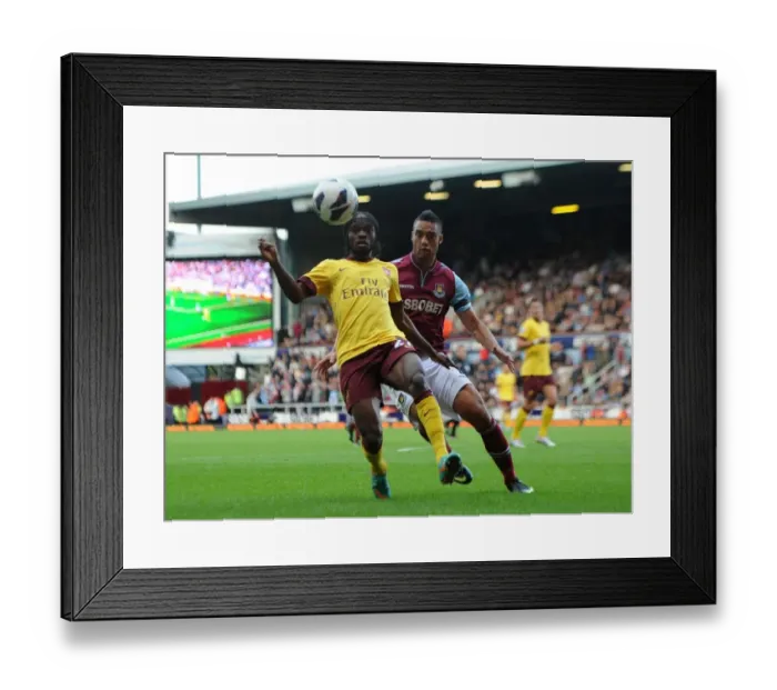 Framed Print : Gervinho vs. Winston Reid: A Football Showdown at Boleyn Ground - Arsenal vs. West Ham United, Premier League 2012-13 Framed Print : Gervinho vs. Winston Reid: A Football Showdown at Boleyn Ground - Arsenal vs. West Ham United, Premier League 2012-13