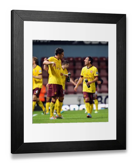 Framed Print : Giroud and Cazorla: A Moment of Connection after West Ham vs. Arsenal (2012-13)