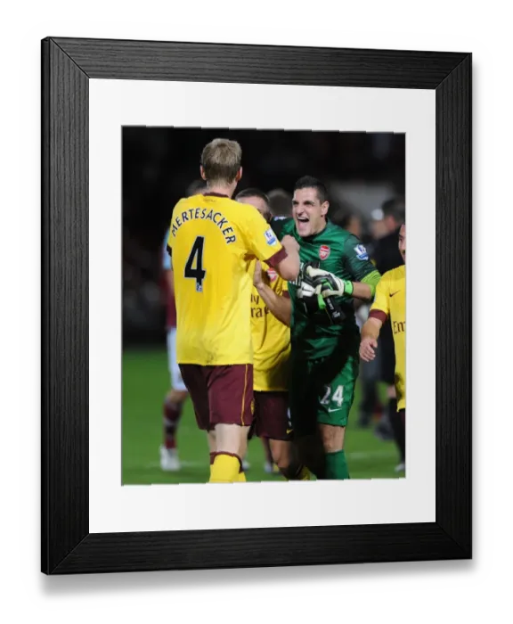 Framed Print : Celebrating Victory: Mannone and Mertesacker, West Ham United vs Arsenal (2012-13) Framed Print : Celebrating Victory: Mannone and Mertesacker, West Ham United vs Arsenal (2012-13)