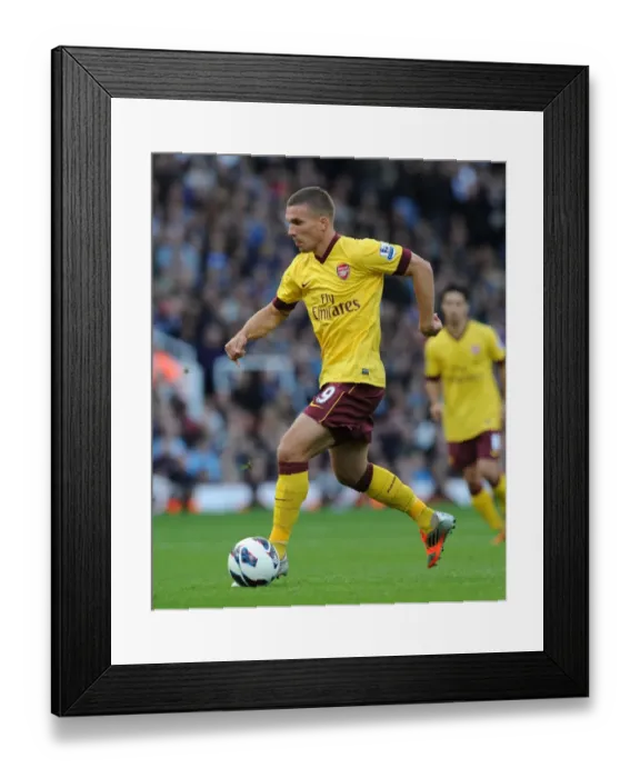 Framed Print : Lukas Podolski: Thriving in Action for Arsenal vs. West Ham United, Premier League 2012-13