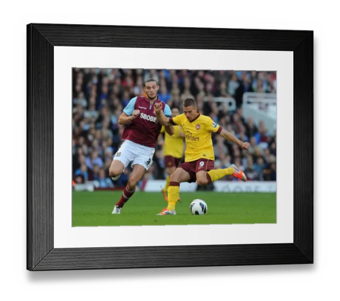 Framed Print : Clash of the Strikers: Podolski vs. Carroll - A Premier League Face-Off Framed Print : Clash of the Strikers: Podolski vs. Carroll - A Premier League Face-Off