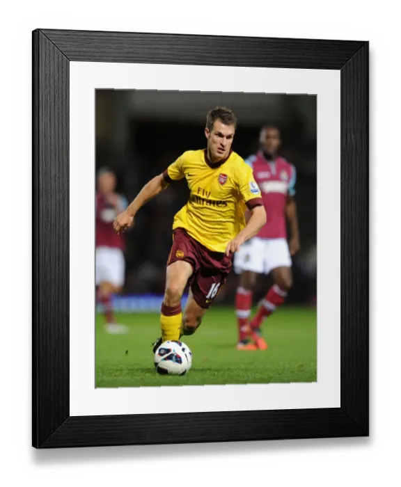 Framed Print : Aaron Ramsey in Action: Arsenal vs West Ham United, Premier League 2012-13