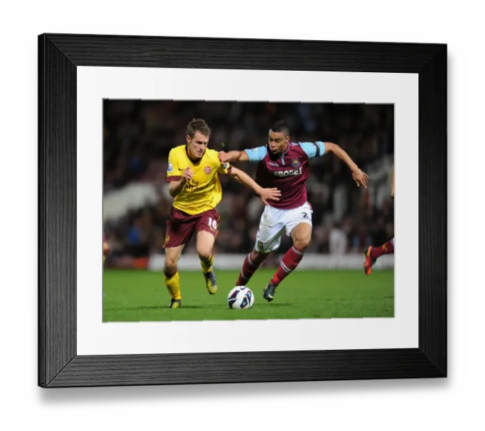 Framed Print : Aaron Ramsey Outsmarts Winston Reid: Premier League Battle Framed Print : Aaron Ramsey Outsmarts Winston Reid: Premier League Battle