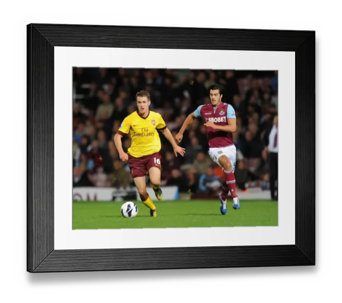 Framed Print : Aaron Ramsey Outmaneuvers James Tomkins: A Pivotal Moment in the West Ham United vs. Arsenal Premier League Clash (2012-13)