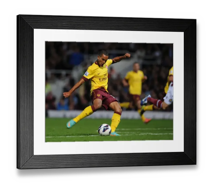 Framed Print : Theo Walcott's Game-Changing Stunner: Arsenal's Victory Goal vs. West Ham United (2012-13)