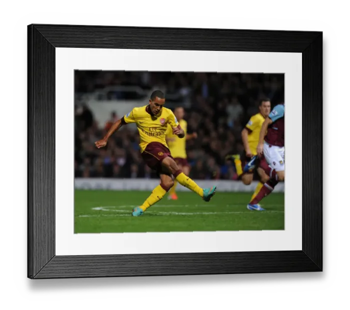 Framed Print : Theo Walcott's Game-Changing Stunner: Arsenal's Victory Goal Against West Ham United (2012-13)