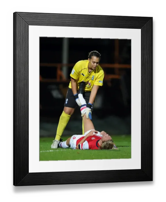 Framed Print : Arsenal's Gilly Flaherty Receives Medical Attention from Birmingham's Rebecca Spencer during FA WSL Continental Cup Final Framed Print : Arsenal's Gilly Flaherty Receives Medical Attention from Birmingham's Rebecca Spencer during FA WSL Continental Cup Final