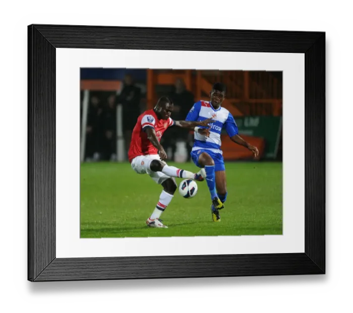 Framed Print : Clash of Young Talents: Frimpong vs. Tshibola in Arsenal U21 vs. Reading U21 (2012-13)