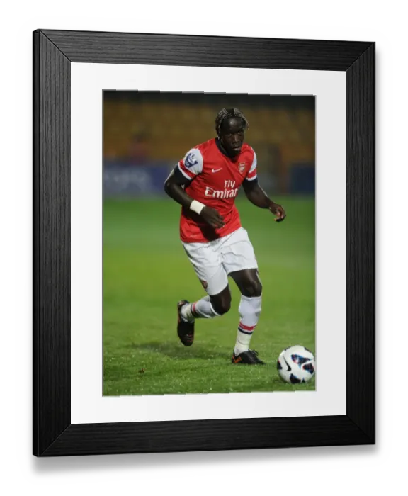 Framed Print : Bacary Sagna Leads Arsenal U21 Against Reading U21 in 2012-13