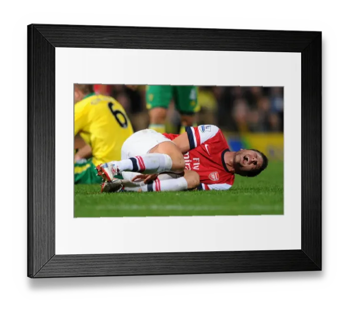 Framed Print : Olivier Giroud's Injury Scare: Norwich City vs Arsenal, Premier League 2012-13