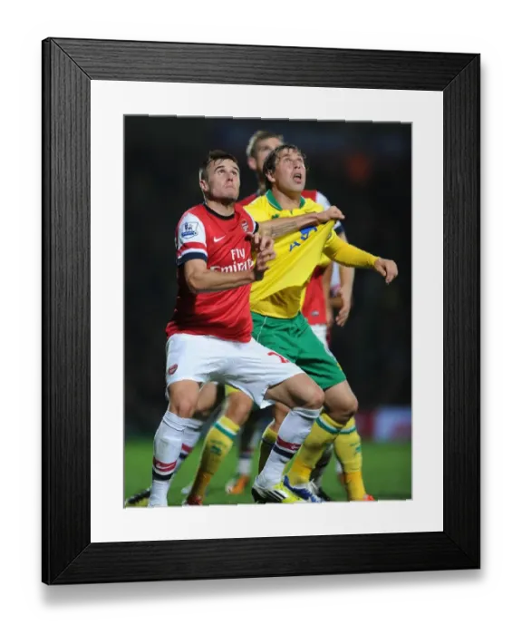 Framed Print : Clash at Carrow Road: Jenkinson vs. Holt in Norwich vs. Arsenal (2012-13) Framed Print : Clash at Carrow Road: Jenkinson vs. Holt in Norwich vs. Arsenal (2012-13)