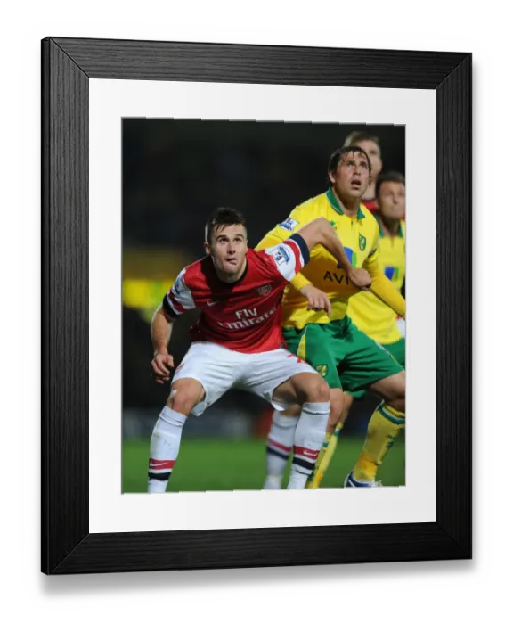 Framed Print : Clash at Carrow Road: Jenkinson vs. Holt in the Premier League Battle