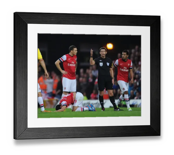 Framed Print : Arsenal's Vermaelen Protests Referee Decision Against Norwich (2012-13)