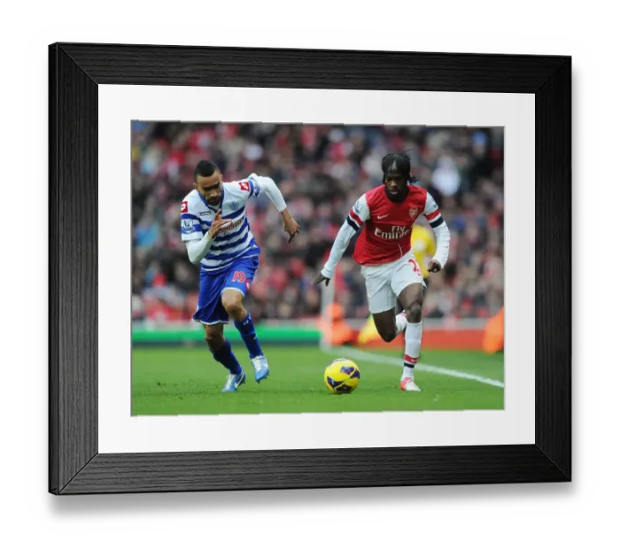 Framed Print : Gervinho Outmaneuvers Jose Bosingwa: Arsenal vs. Queens Park Rangers, 2012-13 Premier League