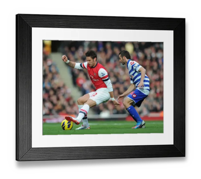 Framed Print : Arsenal's Olivier Giroud Fends Off QPR's Esteban Granero During Premier League Clash (2012-13) Framed Print : Arsenal's Olivier Giroud Fends Off QPR's Esteban Granero During Premier League Clash (2012-13)