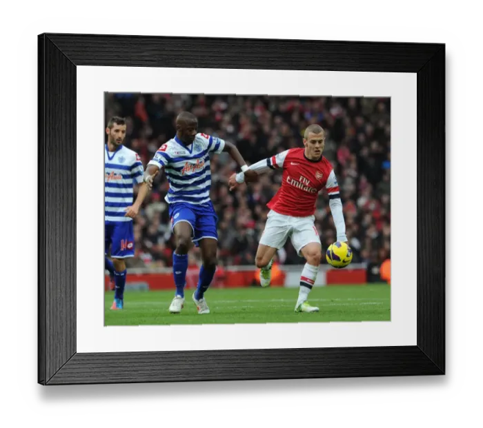 Framed Print : Arsenal's Jack Wilshere Clashes with QPR's Samba Diakite in Premier League Showdown Framed Print : Arsenal's Jack Wilshere Clashes with QPR's Samba Diakite in Premier League Showdown