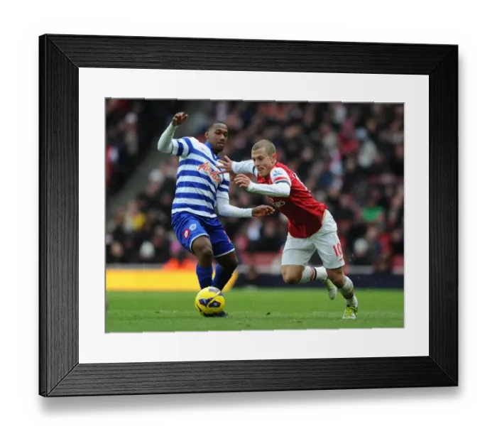 Framed Print : Arsenal's Wilshere Outsmarts Hoilett: Midfield Maestro Dazzles in Arsenal vs. QPR (2012-13 Premier League)