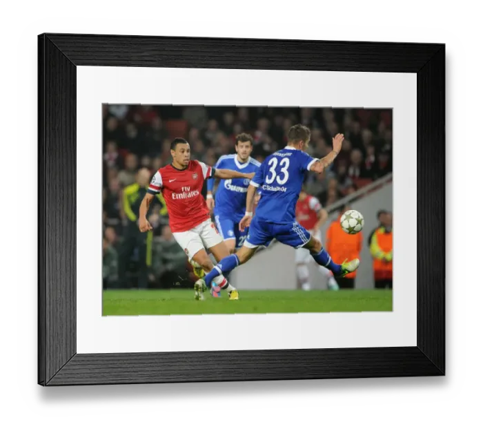 Framed Print : Arsenal's Coquelin Clashes with Schalke's Neustadter in Champions League Showdown Framed Print : Arsenal's Coquelin Clashes with Schalke's Neustadter in Champions League Showdown