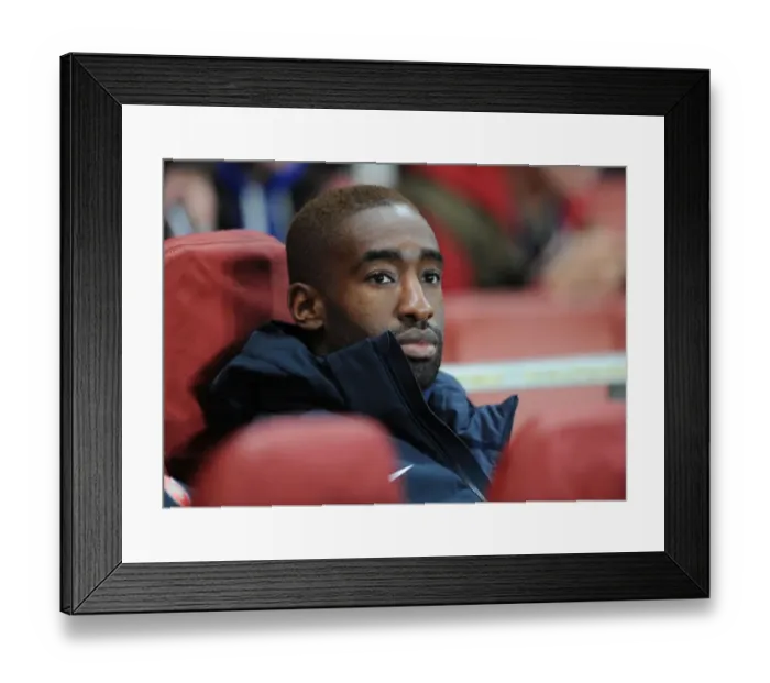 Framed Print : Johan Djourou: Arsenal FC's Focus Before Schalke 04 Clash (2012-13)