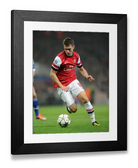 Framed Print : Aaron Ramsey: In Action for Arsenal Against Schalke 04, UEFA Champions League 2012-13 Framed Print : Aaron Ramsey: In Action for Arsenal Against Schalke 04, UEFA Champions League 2012-13
