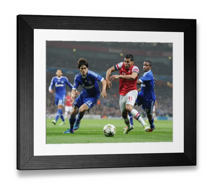 Framed Print : Arsenal's Andre Santos Goes Head-to-Head with Atsuto Uchida and Jefferson Farfan of Schalke in Champions League Showdown Framed Print : Arsenal's Andre Santos Goes Head-to-Head with Atsuto Uchida and Jefferson Farfan of Schalke in Champions League Showdown