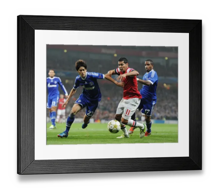 Framed Print : Andre Santos vs. Atsuto Uchida and Jefferson Farfan: Arsenal's Battle in the Champions League Framed Print : Andre Santos vs. Atsuto Uchida and Jefferson Farfan: Arsenal's Battle in the Champions League