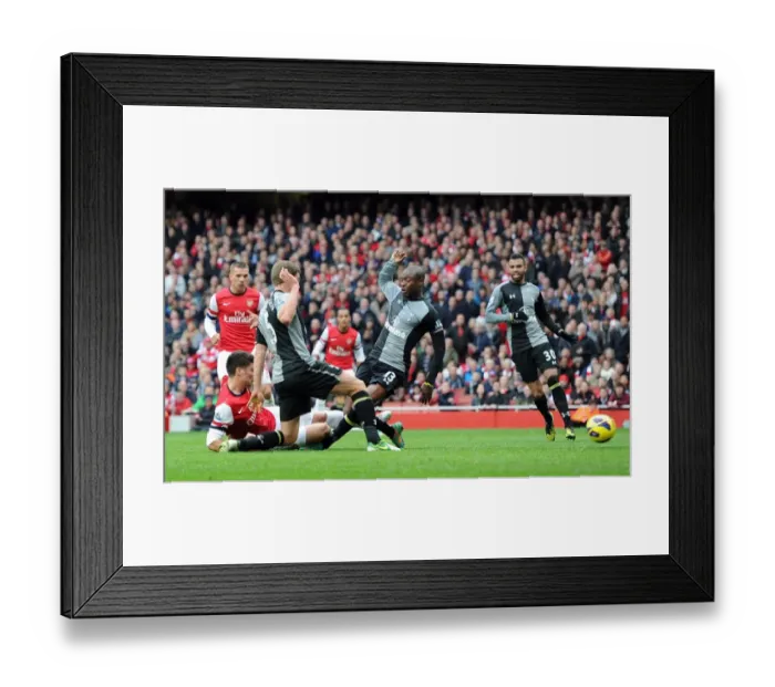 Framed Print : Olivier Giroud Scores Dramatic Goal Against William Gallas in Arsenal vs. Tottenham Rivalry (2012-13)