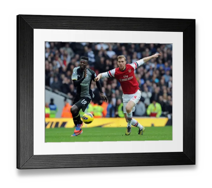 Framed Print : Arsenal vs. Tottenham: Intense Rivalry - Per Mertesacker vs. Emmanuel Adebayor