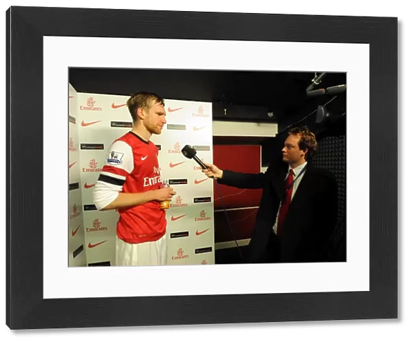 Per Mertesacker (Arsenal) is interviewed after the match by Josh James for Arsenal TV