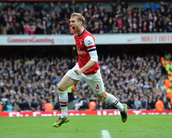 Per Mertesacker celebrates scoring Arsenals 1st goal. Arsenal 5: 2 Tottenham Hotspur