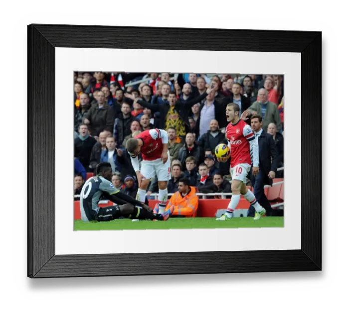 Framed Print : Arsenal vs. Tottenham: Wilshere and Adebayor Clash in the 2012-13 Premier League