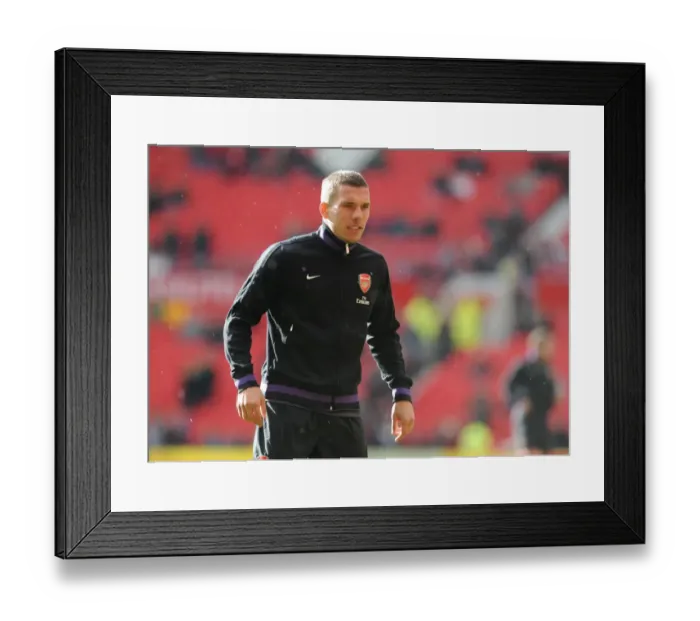 Framed Print : Lukas Podolski (Arsenal). Manchester United 2: 1 Arsenal. Barclays Premier League Framed Print : Lukas Podolski (Arsenal). Manchester United 2: 1 Arsenal. Barclays Premier League