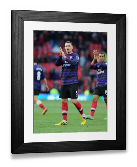 Framed Print : Thomas Vermaelen Celebrates with Arsenal Fans: Manchester United vs. Arsenal (2012-13) Framed Print : Thomas Vermaelen Celebrates with Arsenal Fans: Manchester United vs. Arsenal (2012-13)