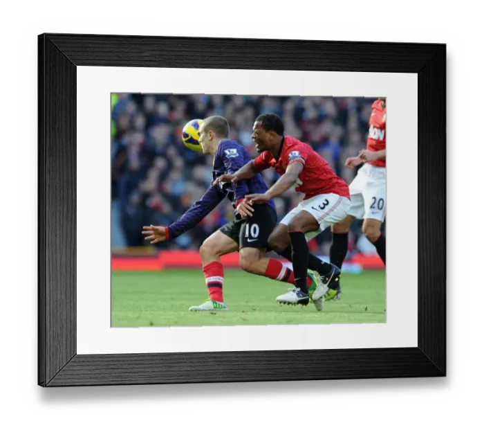 Framed Print : Jack Wilshere vs Patrice Evra: Clash Leads to Red Cards in Manchester United vs Arsenal Premier League Match