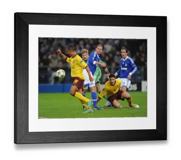 Framed Print : Theo Walcott's Historic Past: Arsenal's Triumph over Schalke 04 - Walcott Scores Stunning Goal Past Benedikt Howedes Framed Print : Theo Walcott's Historic Past: Arsenal's Triumph over Schalke 04 - Walcott Scores Stunning Goal Past Benedikt Howedes