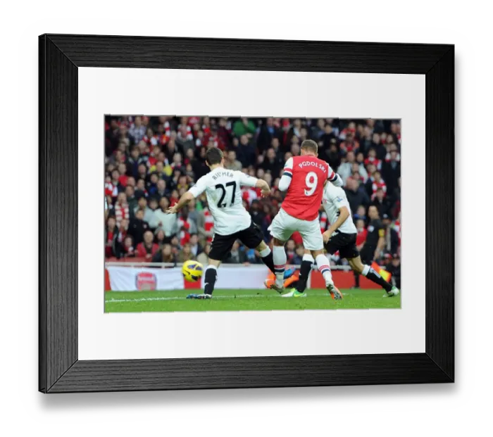 Framed Print : Lukas Podolski Scores Against Sascha Riether: Arsenal vs Fulham, Premier League 2012-13 Framed Print : Lukas Podolski Scores Against Sascha Riether: Arsenal vs Fulham, Premier League 2012-13