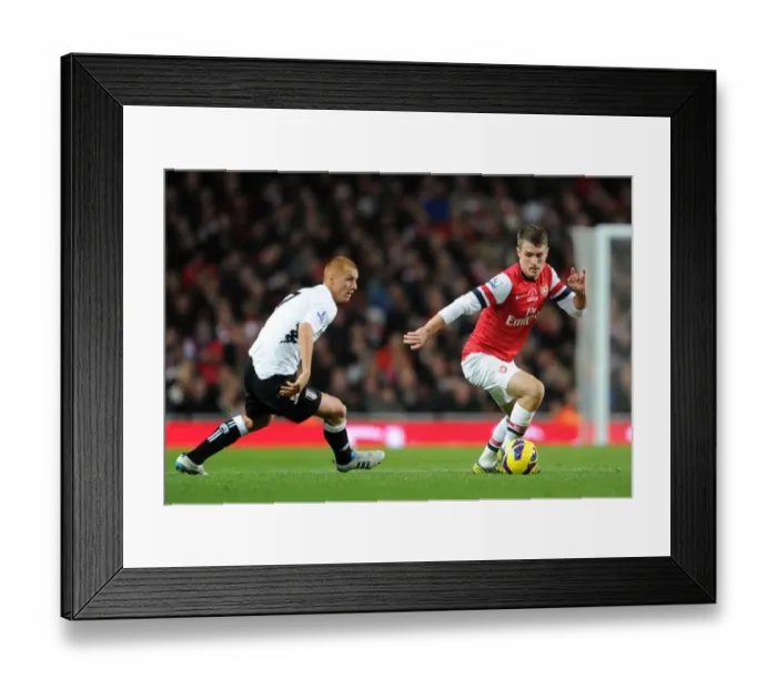 Framed Print : Arsenal's Aaron Ramsey Faces Off Against Fulham's Steve Sidwell (2012-13)