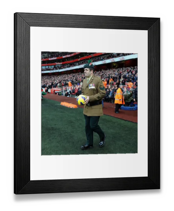 Framed Print : A Soldier brings on the matchball. Arsenal 3: 3 Fulham. Barclays Premier League. Emirates Stadium