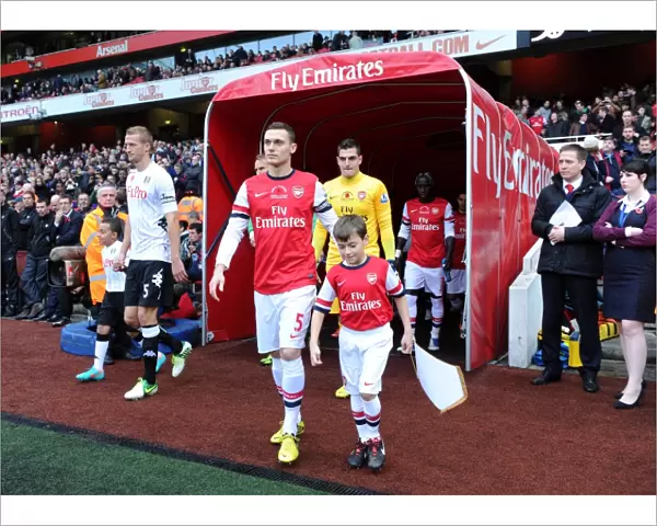 Thomas Vermaelen (Arsenal) leads out the team. Arsenal 3: 3 Fulham. Barclays Premier League