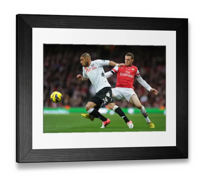 Framed Print : Arsenal vs Fulham: Vermaelen Challenges Dejagah in the 2012-13 Premier League Clash