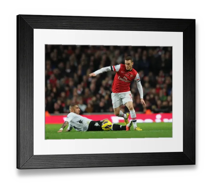 Framed Print : Thomas Vermaelen vs. Ashkan Dejagah: A Football Battle at Emirates Stadium (Arsenal vs. Fulham, 2012-13)