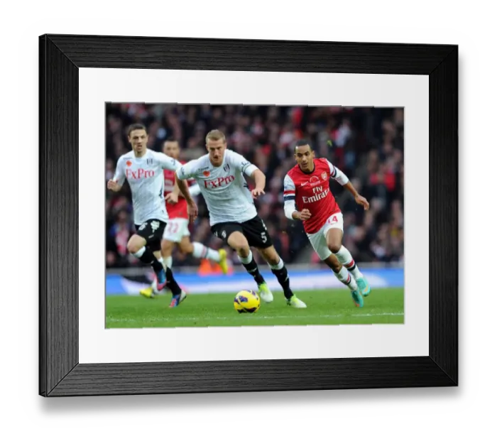 Framed Print : Theo Walcott Outpaces Brede Hangeland: Arsenal vs Fulham, Premier League 2012-13 Framed Print : Theo Walcott Outpaces Brede Hangeland: Arsenal vs Fulham, Premier League 2012-13